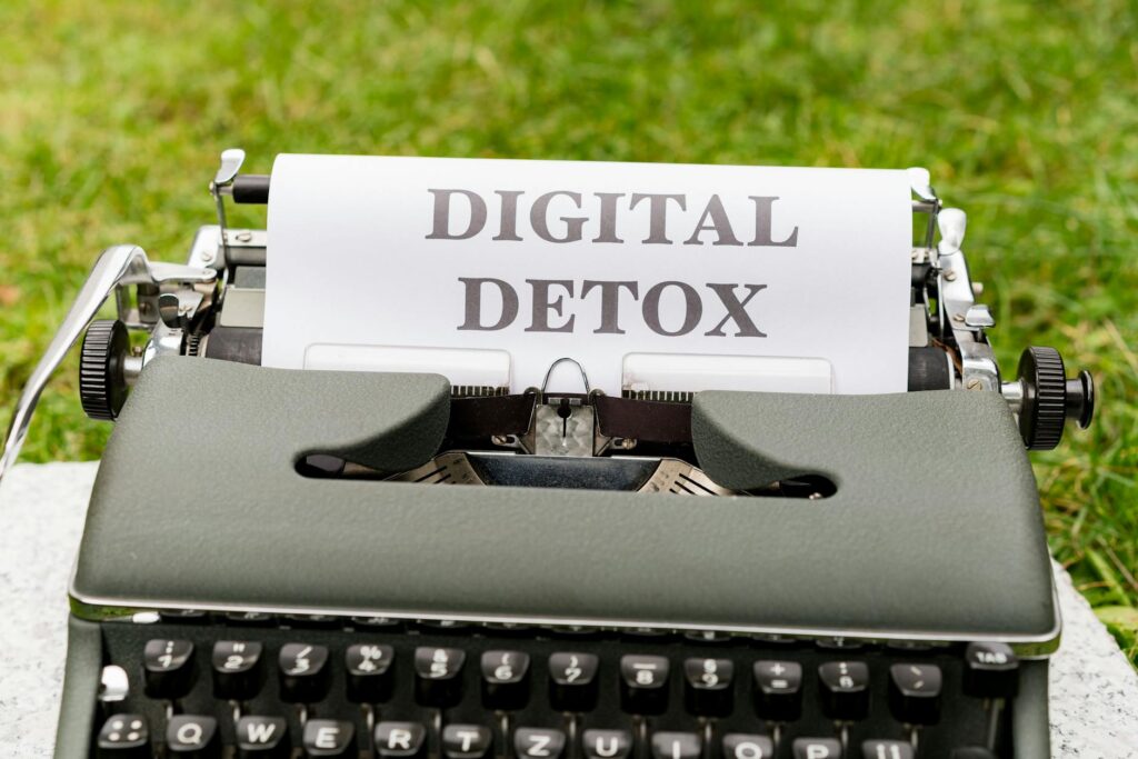 a typewriter with the words digital detox written on it