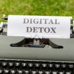 a typewriter with the words digital detox written on it